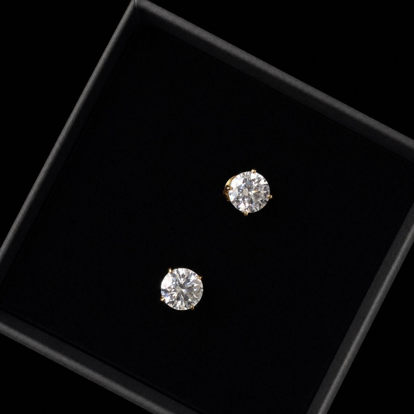 Elegant classic stud earrings featuring 1ct round moissanite stones with D Colour and VVS1 Clarity for exceptional brilliance and clarity.