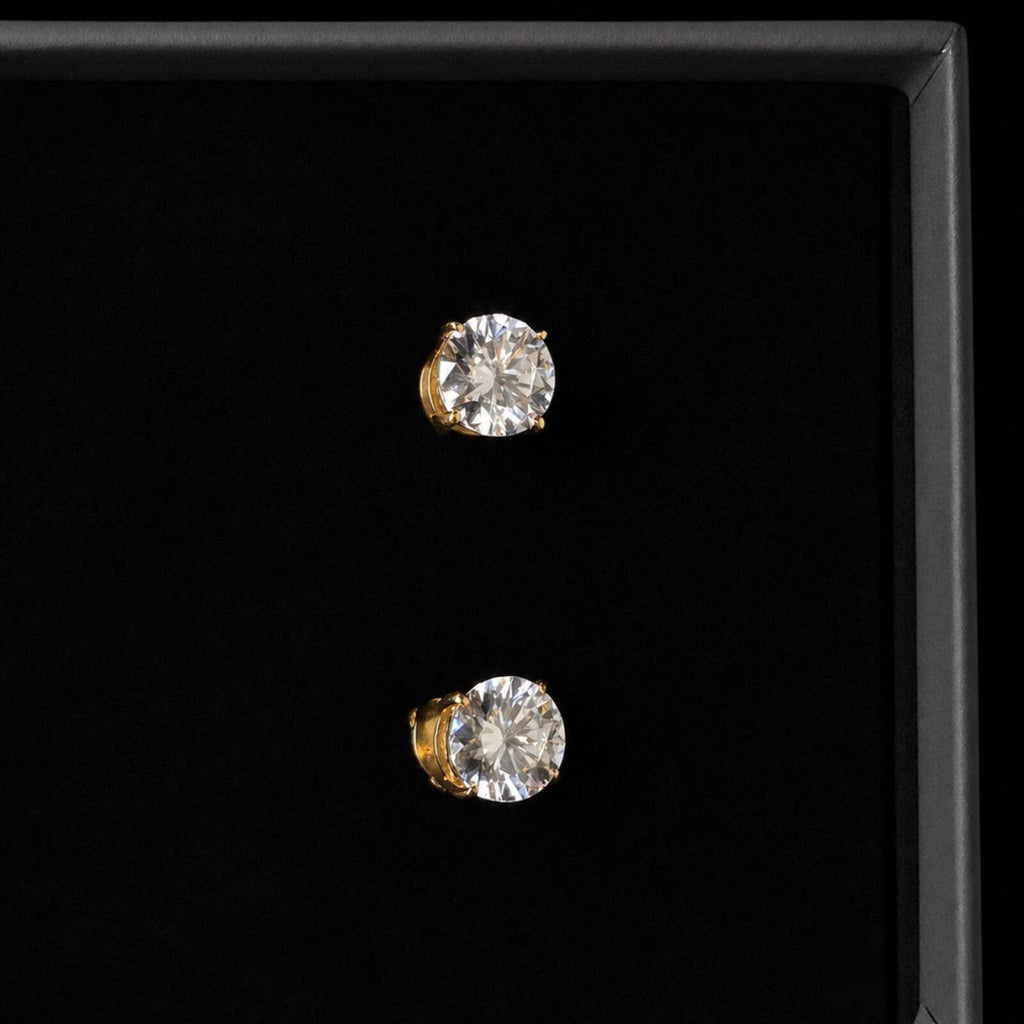 Elegant classic stud earrings featuring 1ct round moissanite stones with D Colour and VVS1 Clarity for exceptional brilliance and clarity.