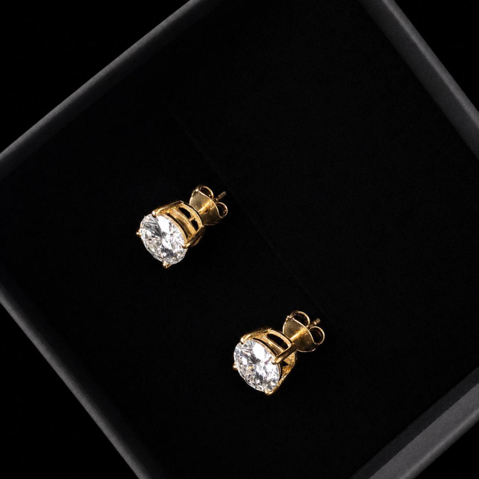 Elegant classic stud earrings featuring 1ct round moissanite stones with D Colour and VVS1 Clarity for exceptional brilliance and clarity.